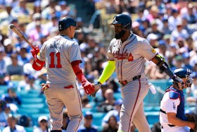 May 5, 2024; Los Angeles, California, USA;  Atlanta Braves designated hitter Marcell Ozuna (20) is greeted by shortstop Orlando Arcia (11) after hitting a home run during the seventh inning against the Los Angeles Dodgers at Dodger Stadium. Mandatory Credit: Kiyoshi Mio-USA TODAY Sports