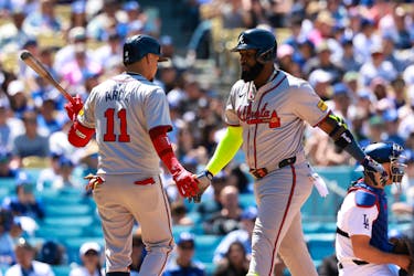 May 5, 2024; Los Angeles, California, USA;  Atlanta Braves designated hitter Marcell Ozuna (20) is greeted by shortstop Orlando Arcia (11) after hitting a home run during the seventh inning against the Los Angeles Dodgers at Dodger Stadium. Mandatory Credit: Kiyoshi Mio-USA TODAY Sports