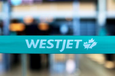 WestJet airline signage is pictured at Vancouver's international airport in Richmond, British Columbia, Canada, February 5, 2019. 
