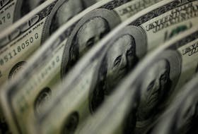 A picture illustration shows U.S. 100 dollar bank notes taken in Tokyo August 2, 2011.