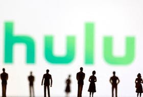 Toy figures of people are seen in front of the displayed Hulu logo, in this illustration taken January 20, 2022.