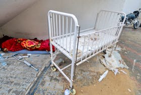 A wounded Palestinian man sleeps at Abu Yousef al-Najjar hospital, amid the ongoing conflict between Israel and the Palestinian Islamist group Hamas, in Rafah, in the southern Gaza Strip, May 6, 2024.