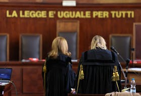 Two judges stand in a courtroom at Milan Court of Justice, in Milan, Italy, April 26, 2024.