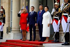 French President Emmanuel Macron and his wife Brigitte Macron welcome China's President Xi Jinping and his wife Peng Liyuan as they arrive at the Elysee Palace in Paris as part of their two-day state visit in France, May 6, 2024.