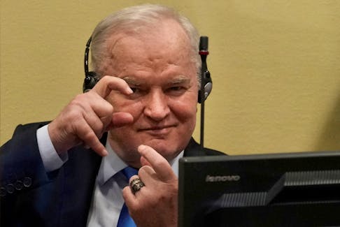 Former Bosnian Serb military leader Ratko Mladic gestures prior to the pronouncement of his appeal judgement at the UN International Residual Mechanism for Criminal Tribunals (IRMCT) in The Hague, Netherlands June 8, 2021. Peter Dejong/Pool via
