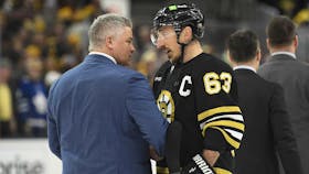 Boston Bruins captain Brad Marchand shakes hands with Toronto Maple Leafs head coach Sheldon Keefe after Game 7 of the teams' first-round NHL playoff series. - Bob DeChiara-USA TODAY Sports
