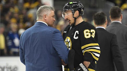 Boston Bruins captain Brad Marchand shakes hands with Toronto Maple Leafs head coach Sheldon Keefe after Game 7 of the teams' first-round NHL playoff series. - Bob DeChiara-USA TODAY Sports