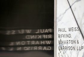 Signage is seen outside of the law firm Paul, Weiss, Rifkind, Wharton & Garrison LLP in Washington, D.C., U.S., August 30, 2020.