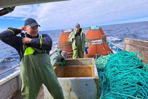 David Boyd’s son Greg and grandson Cole help haul in the last of Boyd’s snow crab quota for the 2024 season. Greg grew up in his father’s fishing boat before pursuing a career that led him to be at the helm of a supertanker, but he’s not eligible to take ownership of his father’s fishing enterprise. Contributed