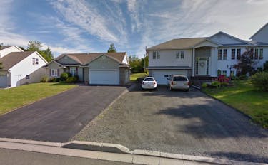 Three people were killed in a collision in front of these homes on Douglas Avenue in Fredericton on Sunday morning, May 5.