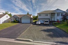 Three people were killed in a collision in front of these homes on Douglas Avenue in Fredericton on Sunday morning, May 5.
