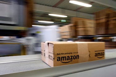 A parcel moves on the conveyor belt at Amazon's logistics centre in Graben near Augsburg December 16, 2013.