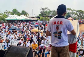 A leader of the Central General Staff (EMC), a faction of the FARC guerrilla that rejected a 2016 peace agreement and continued the armed struggle, speaks in front of the community at the inauguration of a school built by that group illegal armed in the Llanos del Yari, Colombia, April 12, 2024.