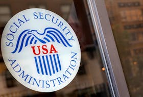 FILE PHOTO A sign is seen on the entrance to a Social Security office in New York City, U.S., July 16, 2018.