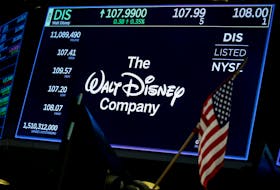 A screen shows the logo and a ticker symbol for The Walt Disney Company on the floor of the New York Stock Exchange (NYSE) in New York, U.S., December 14, 2017.