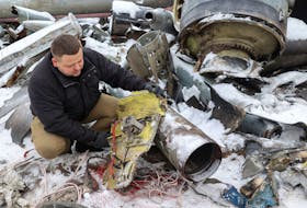 A representative from the prosecutor's office shows parts of an unidentified missile, which Ukrainian authorities believe to be made in North Korea and was used in a strike in Kharkiv earlier this week, amid Russia's attack on Ukraine, in Kharkiv, Ukraine January 6, 2024.