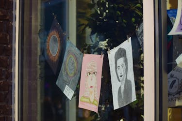 Young artists from Trenton Middle School were showcased in the display window of The White Lotus.