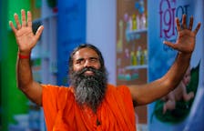 Indian yoga guru Baba Ramdev gestures as talks to media after a news conference in New Delhi, India, May 4, 2017. To match Special Report INDIA-MODI/RAMDEV
