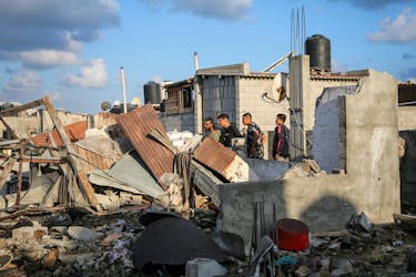 Palestinians inspect the site of an Israeli strike on a house, amid the ongoing conflict between Israel and the Palestinian Islamist group Hamas, in Rafah, in the southern Gaza Strip May 7, 2024.