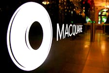 The logo of Australian investment bank Macquarie Group adorns a desk in the reception area of its headquarters in Sydney, Australia, Oct. 28, 2016.