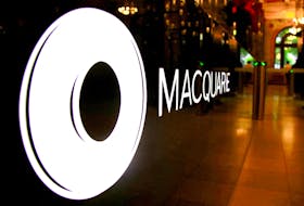 The logo of Australian investment bank Macquarie Group adorns a desk in the reception area of its headquarters in Sydney, Australia, Oct. 28, 2016.