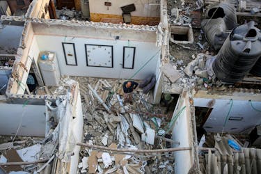 Palestinians inspect a house damaged in an Israeli strike, amid the ongoing conflict between Israel and the Palestinian Islamist group Hamas, in Rafah, in the southern Gaza Strip May 7, 2024.