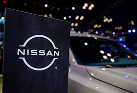A Nissan logo is seen next to a vehicle during the New York International Auto Show, in Manhattan, New York City, U.S., April 5, 2023.