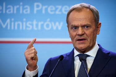 Polish Prime Minister Donald Tusk gestures during a press conference with Danish Prime Minister Mette Frederiksen in Warsaw, Poland, April 15, 2024.