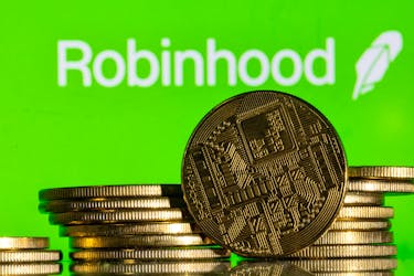Robinhood logo and representations of cryptocurrency are seen in this illustration taken December 12, 2023.