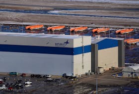 Airplane fuselages bound for Boeing's 737 Max production facility sit in storage behind Spirit AeroSystems Holdings Inc headquarters, in Wichita, Kansas, U.S. December 17, 2019.