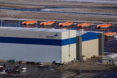 Airplane fuselages bound for Boeing's 737 Max production facility sit in storage behind Spirit AeroSystems Holdings Inc headquarters, in Wichita, Kansas, U.S. December 17, 2019.