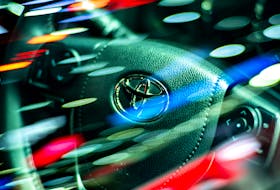 The logo of Toyota Motor Corp. is seen on a steering wheel inside a Vios model at the 39 Thailand International Motor Expo, in Bangkok, Thailand, November 30, 2022.