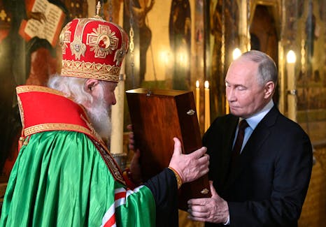 Russian President Vladimir Putin and Patriarch Kirill of Moscow and all Russia attend a prayer service following an inauguration ceremony at the Kremlin's Annunciation Cathedral in Moscow, Russia May 7, 2024. Sputnik/Alexey Maishev/Kremlin via REUTERS