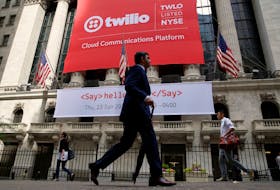 A banner for communications software provider Twilio Inc., hangs on the facade of the New York Stock Exchange (NYSE) to celebrate the company's IPO in New York City, U.S., June 23, 2016.