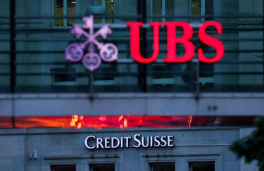 Logos of Swiss banks Credit Suisse and UBS are seen before a news conference in Zurich Switzerland, August 30, 2023. 