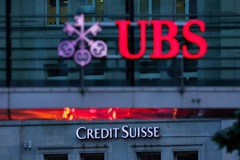 Logos of Swiss banks Credit Suisse and UBS are seen before a news conference in Zurich Switzerland, August 30, 2023. 