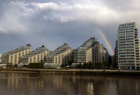 A rainbow is seen over apartments in Wandsworth on the River Thames as UK house prices continue to fall, in London, Britain, August 26, 2023.  