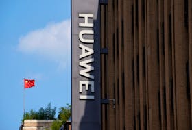A Chinese flag flutters near a Huawei store in Shanghai, China September 8, 2023.