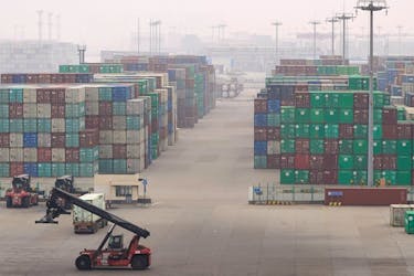 Stacks of containers are seen at the Yangshan Deep Water Port in Shanghai, China January 13, 2022.