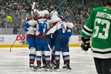 Colorado Avalanche right wing Mikko Rantanen (96), right wing Valeri Nichushkin (13), centre Nathan MacKinnon (29) and defenceman Cale Makar (8) celebrate the game-tying goal scored by MacKinnon against the Dallas Stars during the third period in game one of the second round of the 2024 Stanley Cup Playoffs at American Airlines Center in Dallas on Tuesday, May 7, 2024. - Jerome Miron / USA TODAY Sports