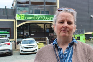 Cape Breton Farmers' Market manager Pauline Singer: "We are not denying that we owe the back taxes. We absolutely do," says Singer, standing out in front of a locked-up market on Falmouth Street in Sydney on Wednesday. IAN NATHANSON/CAPE BRETON POST