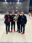 Head coach Gardiner MacDougall, left, of Bedeque, P.E.I., and Hockey Canada’s manager of medical services Kevin Elliott, right, of Charlottetown join assistant coach Travis Crickard, second right, and equipment manager A.J. Murley for a photo with the International Ice Hockey Federation world under-18 male hockey championship trophy. Team Canada defeated the United States 6-4 in the gold-medal game in Espoo, Finland, on May 4. Crickard, head coach of the Quebec Maritimes Junior Hockey League’s Saint John Sea Dogs, and Murley are from St. John’s. Gardiner MacDougall • Special to The Guardian