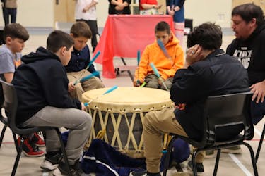 Boys from Pictou Landing First Nation school perform a song during the grand blessing of the school. The ceremony had been postponed due to COVID-19 restrictions. ANGELA CAPOBIANCO