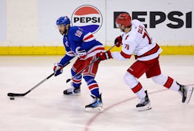 May 7, 2024; New York, New York, USA; New York Rangers center Vincent Trocheck (16) controls the puck against Carolina Hurricanes defenseman Brady Skjei (76) during the second overtime of game two of the second round of the 2024 Stanley Cup Playoffs at Madison Square Garden. Mandatory Credit: Brad Penner-USA TODAY Sports