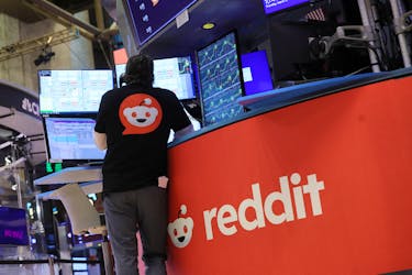 A trader wears a t-shirt with Reddit's logo, at the New York Stock Exchange (NYSE) in New York City, U.S., March 21, 2024.