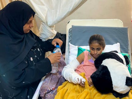 Lama Abu Holi, an 8-year-old injured Palestinian girl rests in Al-Aqsa Hospital, amid the ongoing conflict between Israel and the Palestinian Islamist group Hamas, in Deir Al-Balah in central Gaza Strip May 7, 2024.