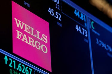 The logo and trading information for Wells Fargo are displayed on a screen on the floor of the New York Stock Exchange (NYSE) in New York City, U.S., October 14, 2016. 