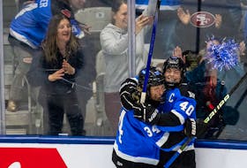 Toronto captain Blayre Turnbull, right, celebrates with teammate Hannah Miller after scoring against Minnesota in the opening game of the PWHL semifinal series on Wednesday night in Toronto. - PWHL