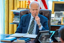 U.S. President Joe Biden speaks on the phone with Israeli Prime Minister Benjamin Netanyahu in this White House handout image taken in the Oval Office in Washington, U.S., April 4, 2024. The White House/Handout via
