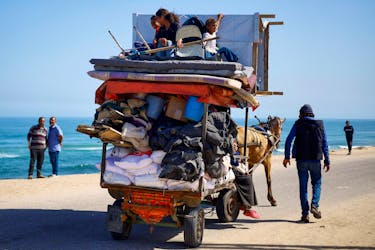 Palestinians travel in an animal-drawn cart as they flee Rafah after Israeli forces launched a ground and air operation in the eastern part of the southern Gaza city, amid the ongoing conflict between Israel and Hamas, in the southern Gaza Strip May 9, 2024.